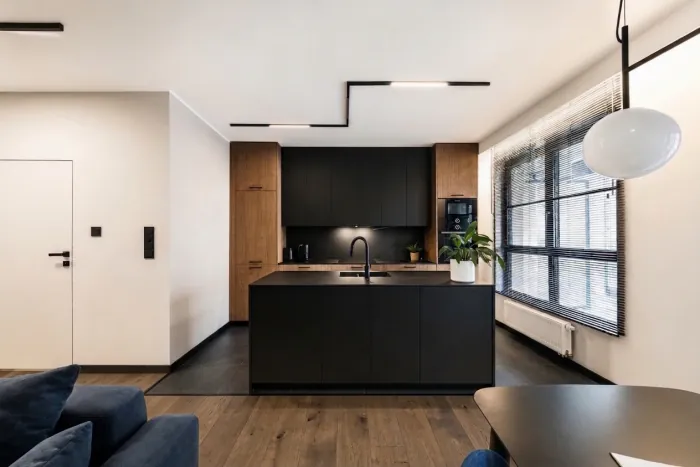 Step 1: the apartment with dark graphite tiles in the kitchen and wide smoked oak planks in the living area; everything else unchanged