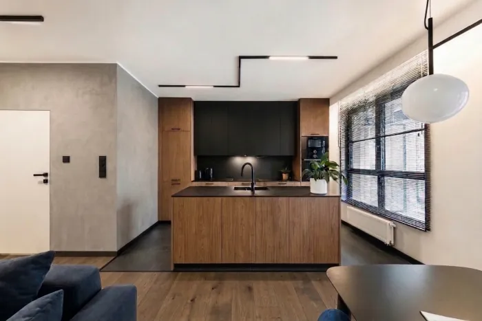 Step 3: the kitchen island fronts in warm wood matching the tall units